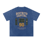 Back of Dark Blue washed oversized T-shirt with a large Distrito Capital 90 poster graphic
