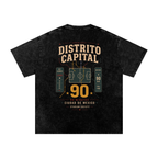 Back of Black washed oversized T-shirt with a large Distrito Capital 90 poster graphic