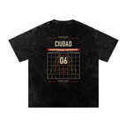 Back of black washed oversized T-shirt with a large Ciudad Football Society grid graphic