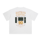 Back of White enzyme-washed T-shirt with a large Distrito Capital 90 poster graphic