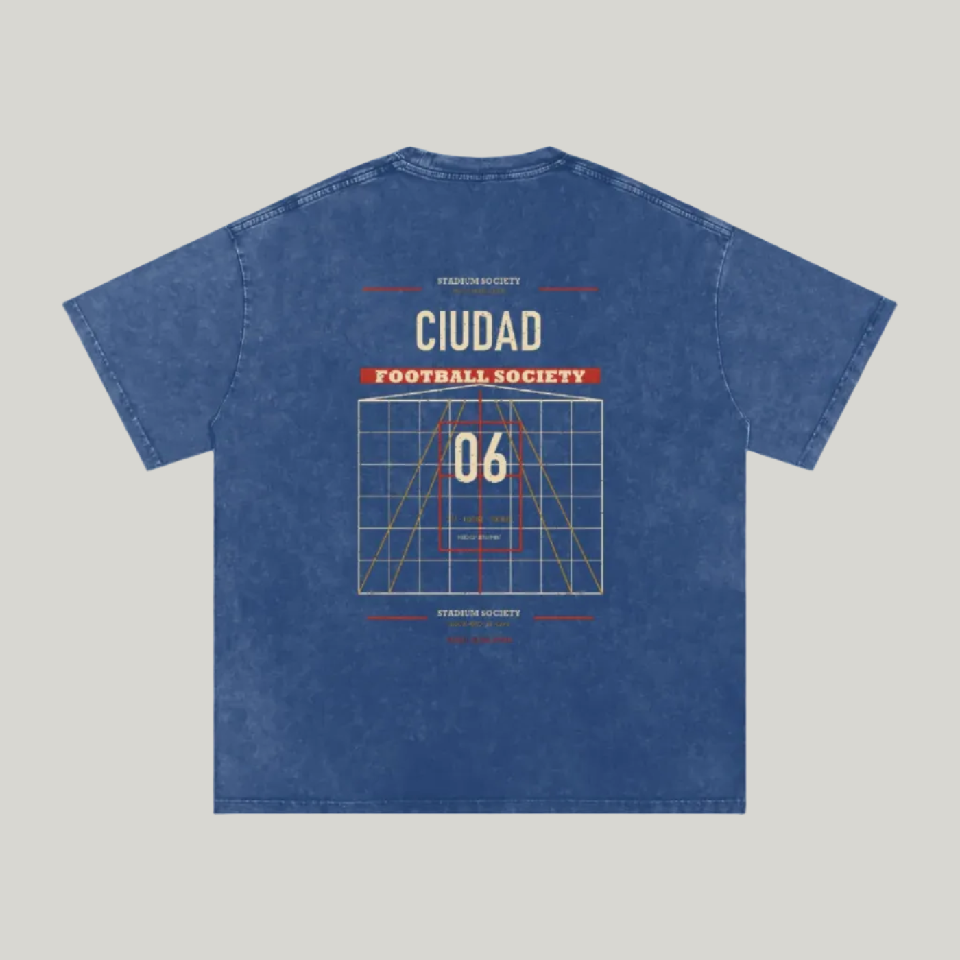 Back of Dark Blue washed oversized T-shirt with a large Ciudad Football Society grid graphic