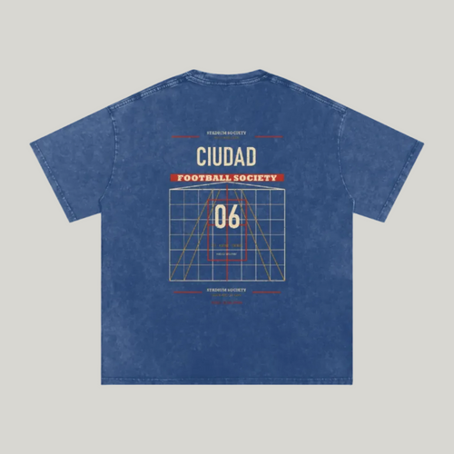 Back of Dark Blue washed oversized T-shirt with a large Ciudad Football Society grid graphic