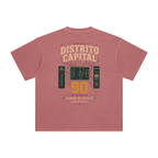 Back of Brick Red enzyme-washed T-shirt with a large Distrito Capital 90 poster graphic