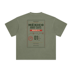 Back of Gray Green enzyme-washed T-shirt with a large Mexico Away Days travel graphic